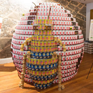 canned food structure of a bee in front of a world